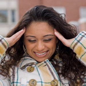 This woman is experiencing an intense amount of stress.